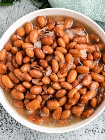 Top-down view of the ham hock and beans in a bowl.