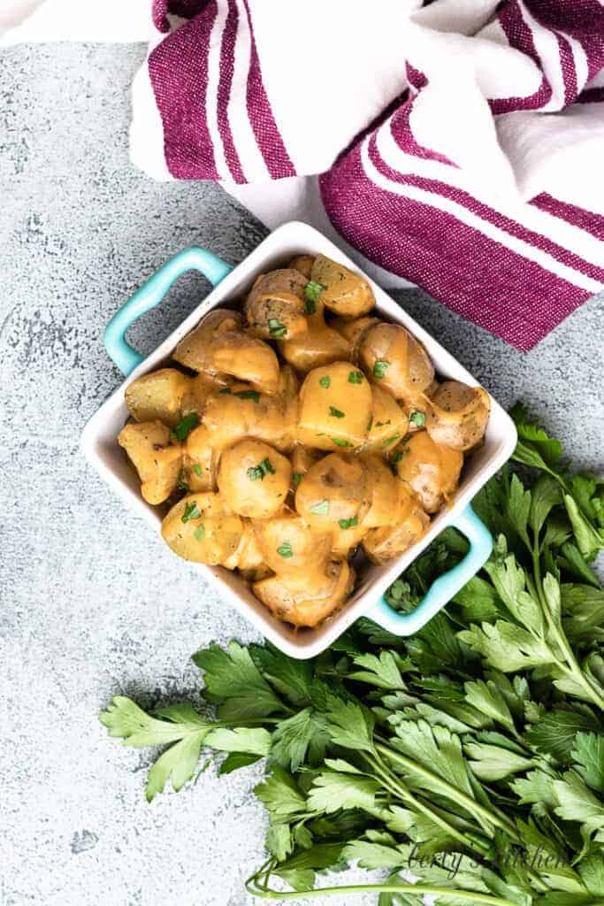 Top-down view of the potatoes in a square serving dish.