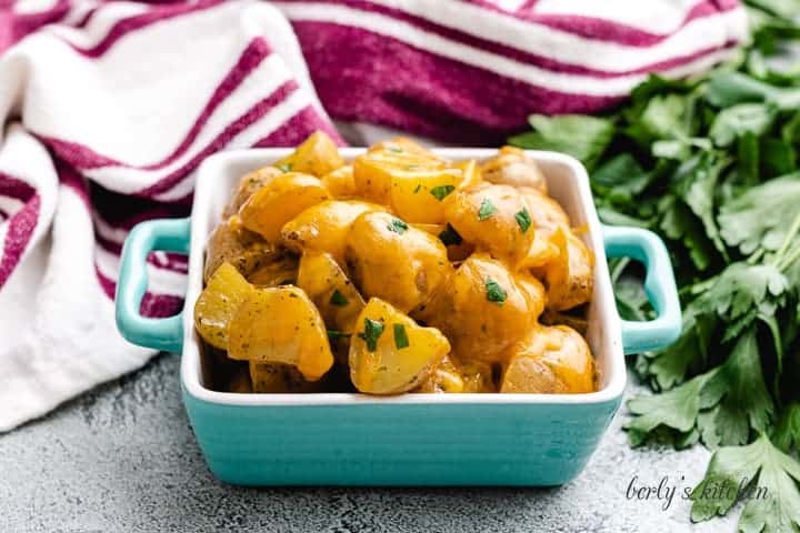 Instant Pot ranch potatoes topped with shredded cheddar cheese.
