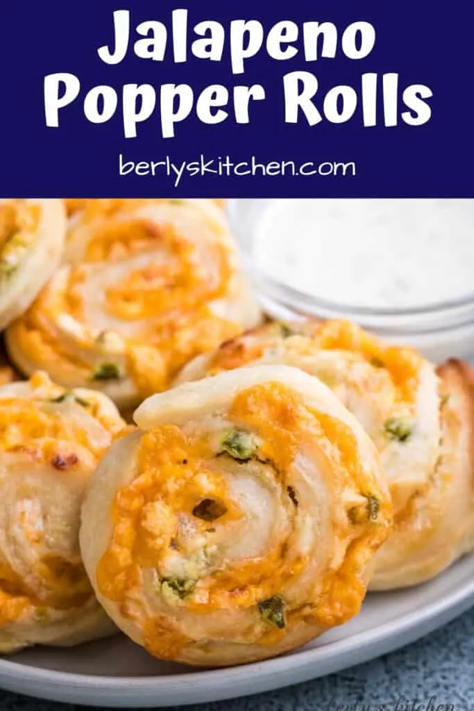 Jalapeno popper rolls on a plate with ranch dressing.