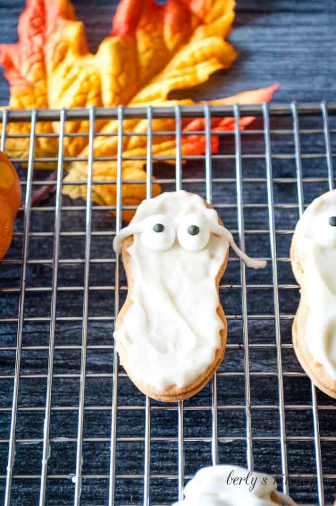 Candy eyes placed on the warm chocolate cookies..