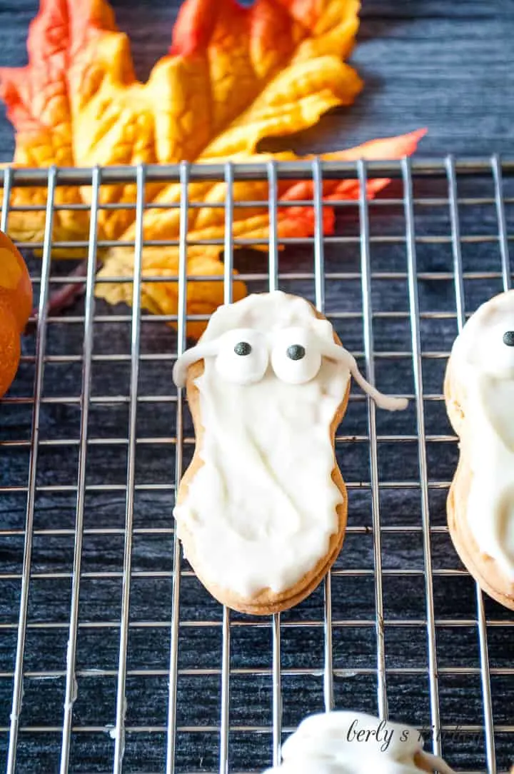 Candy eyes placed on the warm chocolate cookies..