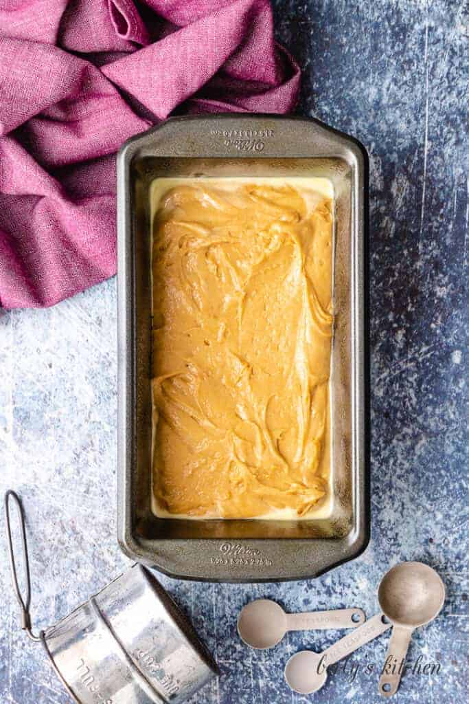 The batter has been transferred to a loaf pan.