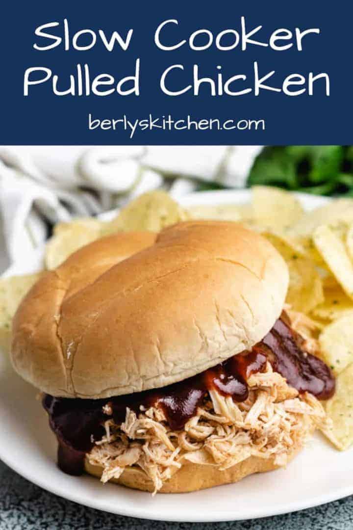 A slow cooker BBQ chicken sandwich with chips.