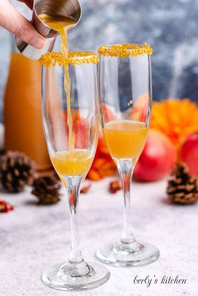 Fresh cider added to the champagne glasses.