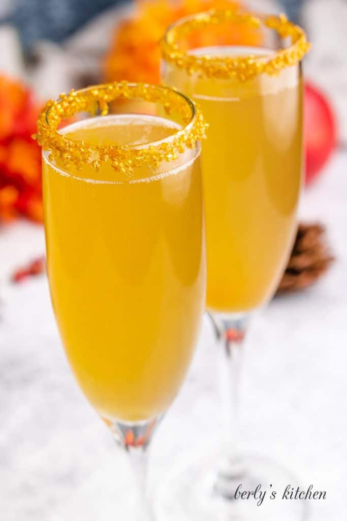 An up-close view of the cocktails in champagne glasses.