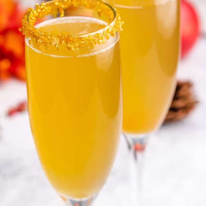 An up-close view of the cocktails in champagne glasses.