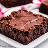 A serving of the homemade brownies on a plate.