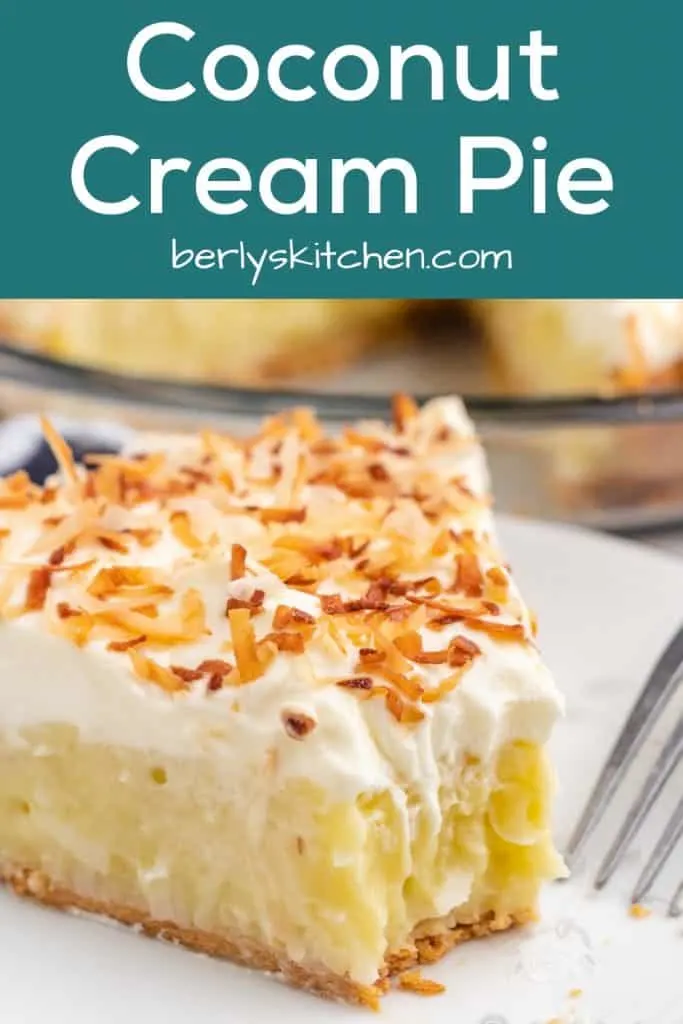 A fork removing a bite from the coconut cream pie slice.