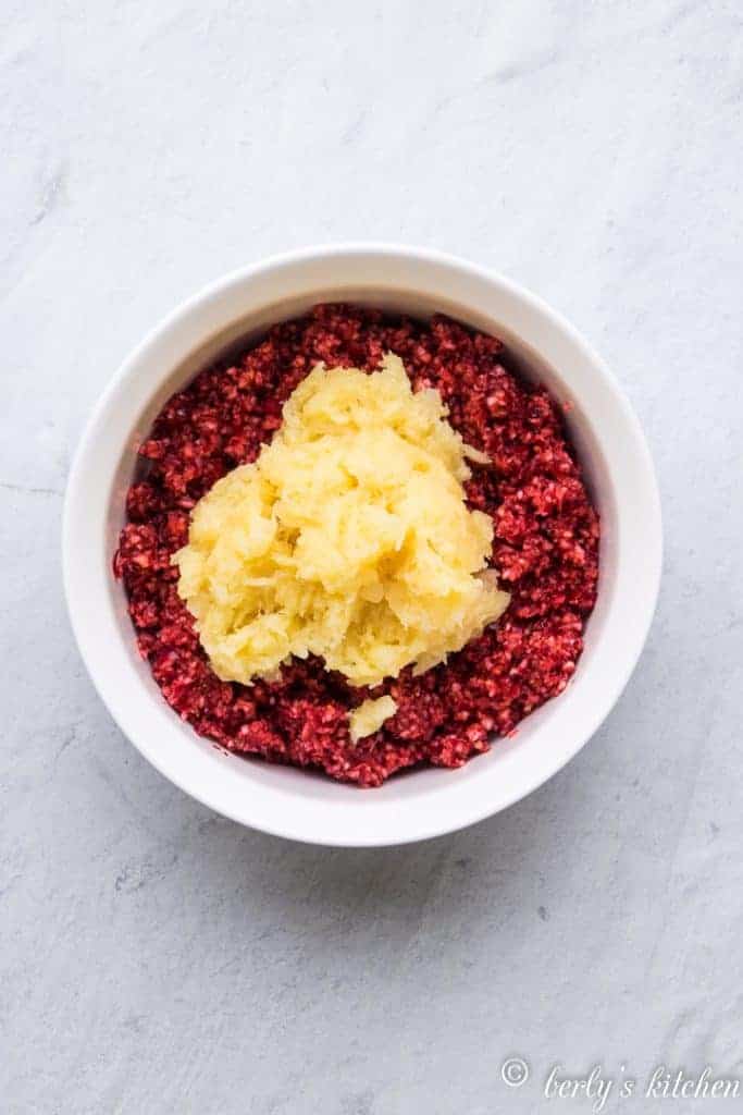 Chopped cranberries and pineapple in abowl.