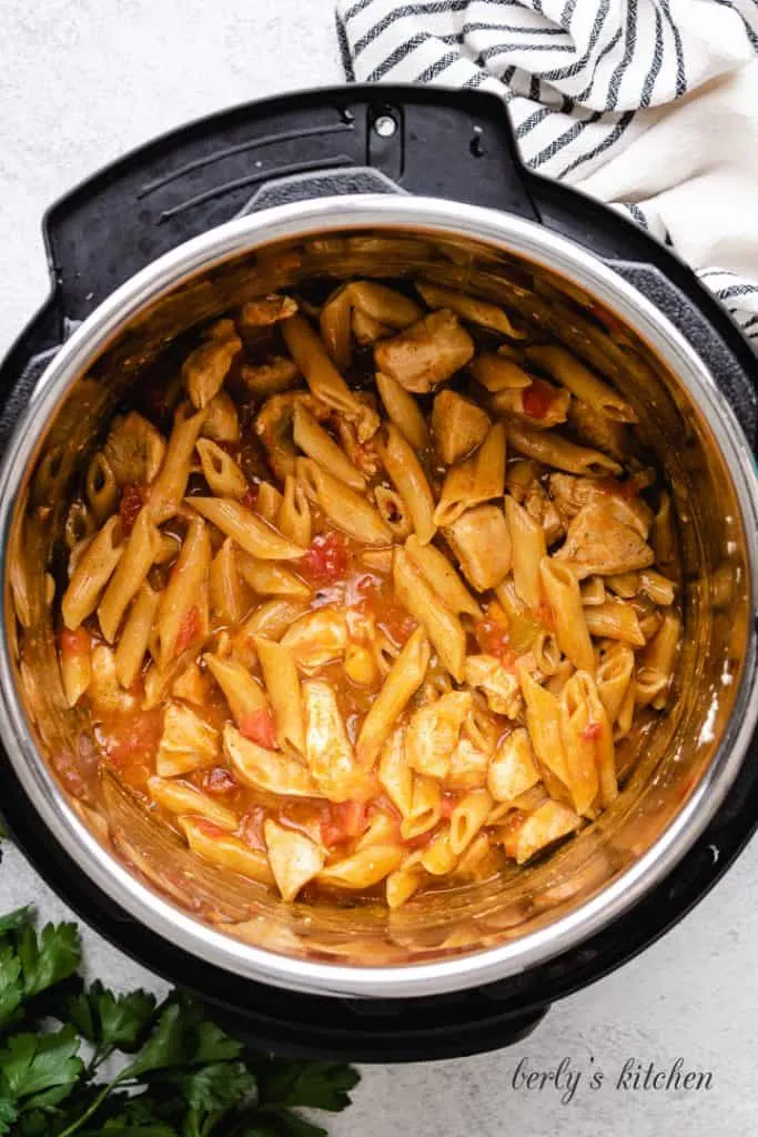The pressure cooked King Ranch chicken pasta ingredients in the liner.