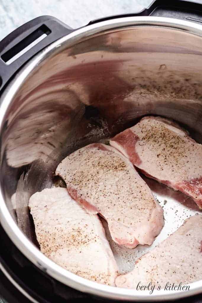 The meat sautéing in the pressure cooker. 