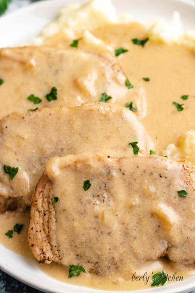 A up-close picture showing the finished chops with gravy and taters.