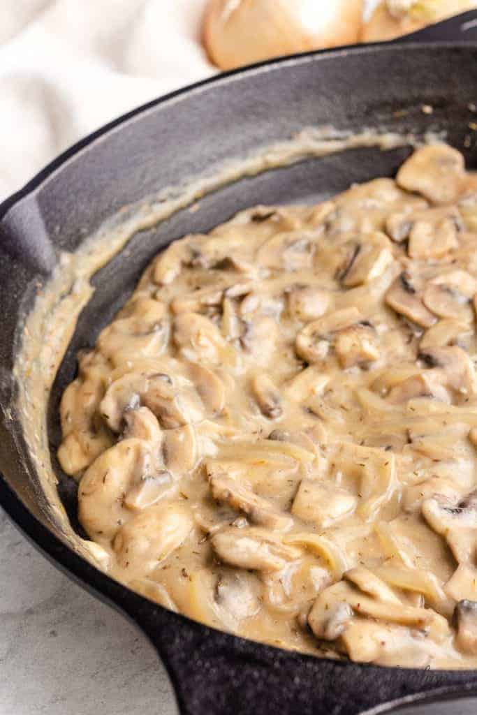 The broth mixture added to the skillet.