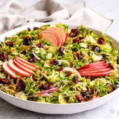 The shaved brussel sprout salad served in a bowl.