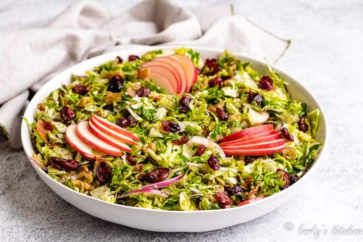 The shaved brussel sprout salad served in a bowl.