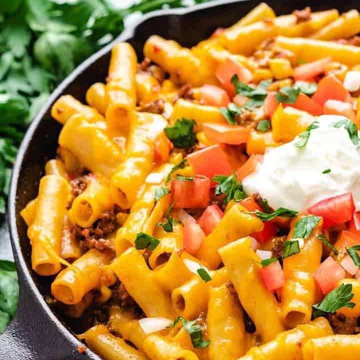 A cast iron skillet filled with the finished pasta.