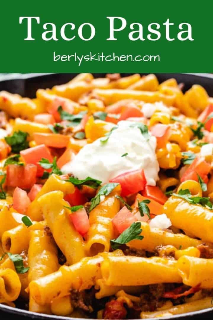 Cheesy taco pasta topped with sour cream.