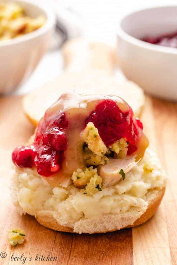 Brown gravy poured over the cranberry sauce.