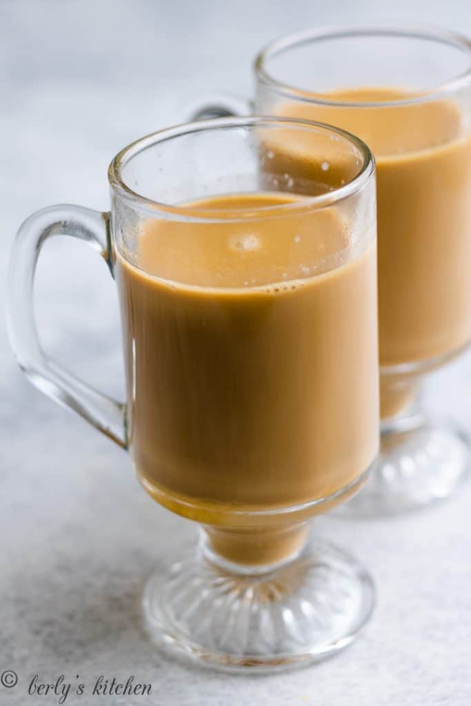 The ungarnished coffee drinks in glass mugs.