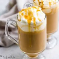 Butterscotch coffee in mugs topped with whipped cream.