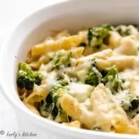 The cooked broccoli cheese pasta bake cooling in a casserole dish.