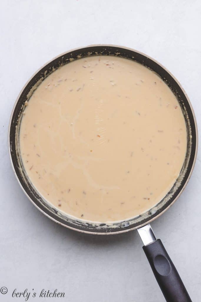 Butter, heavy cream, and soup mix in a skillet.