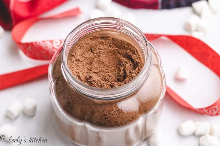 Homemade hot chocolate mix in a glass jar.