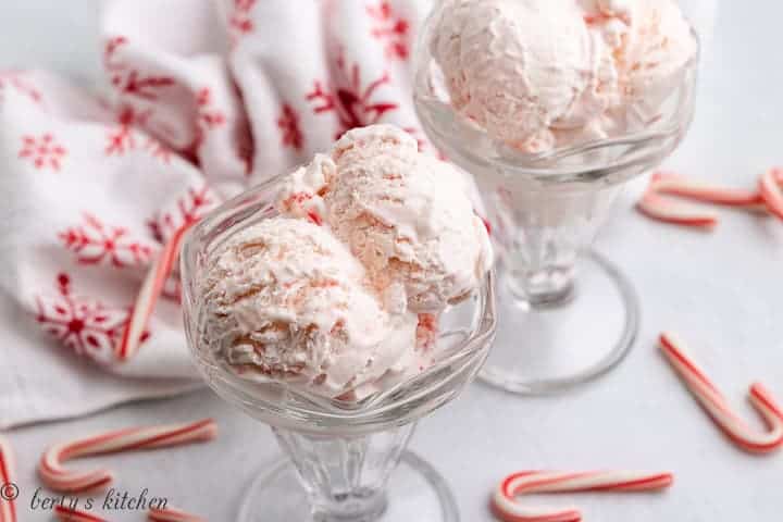 Two sundae tulip glass filled with peppermint ice cream.