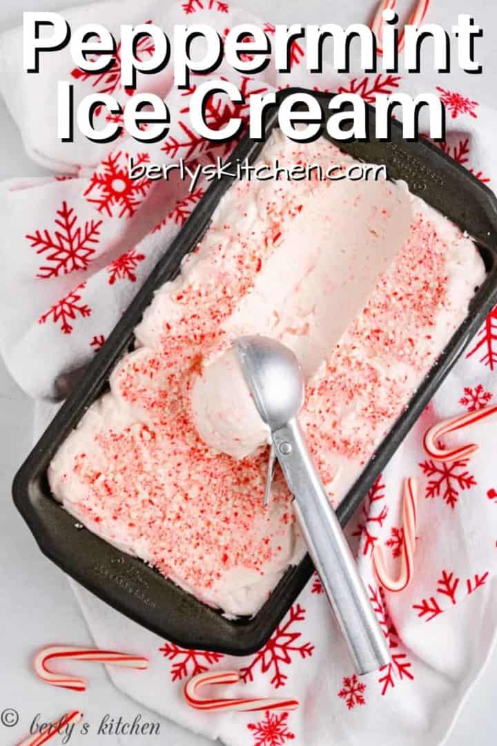 Peppermint ice cream being scooped from a loaf pan.