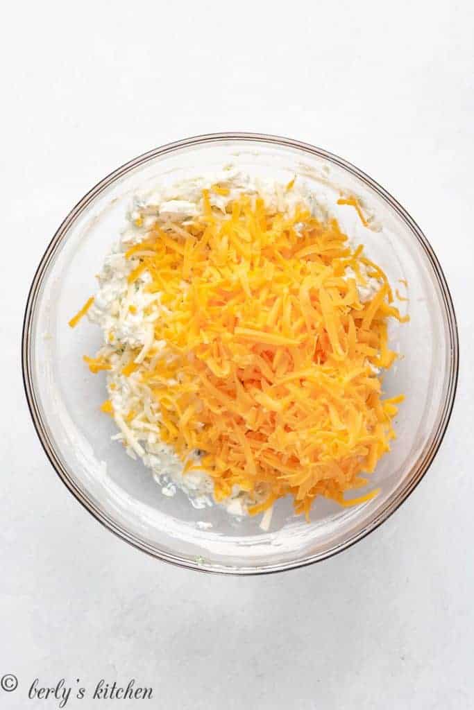 Shredded cheese added to the cream cheese mixture.