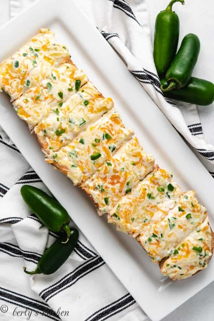 Top-down view of the cheesy bread on a serving platter.