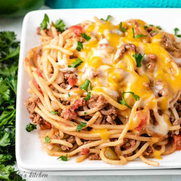 Scoops of ground beef pasta with cheese on a plate.