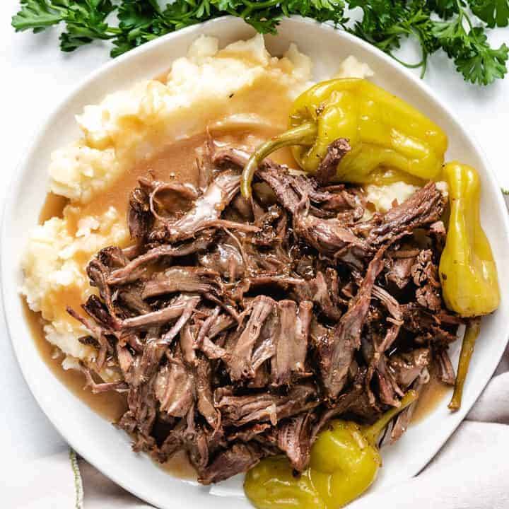 Mississippi Pot Roast Pot roast and mashed potatoes with pepperoncinis.