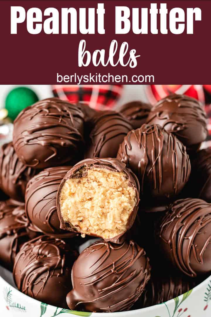 Peanut butter balls stacked in a holiday tin.