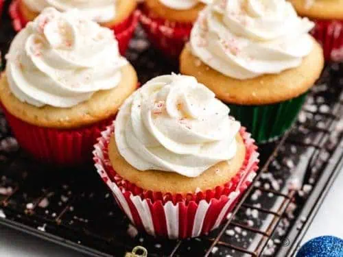 The finished candy cane cupcakes on a wire rack.