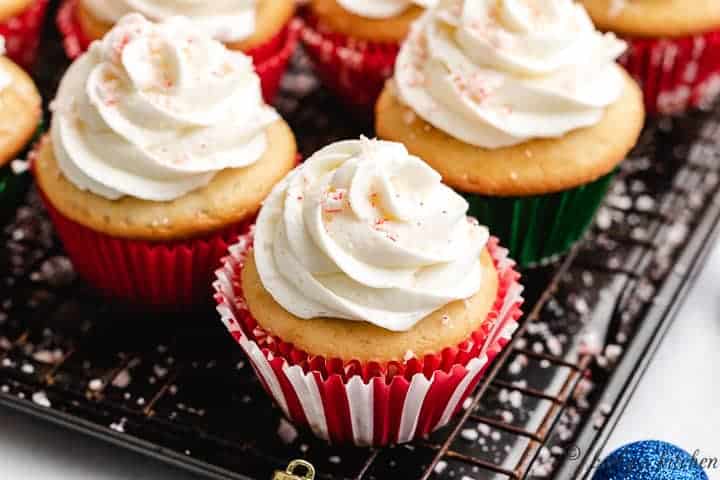 The finished candy cane cupcakes on a wire rack.