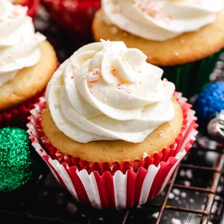 A cooled cupcake with peppermint frosting.