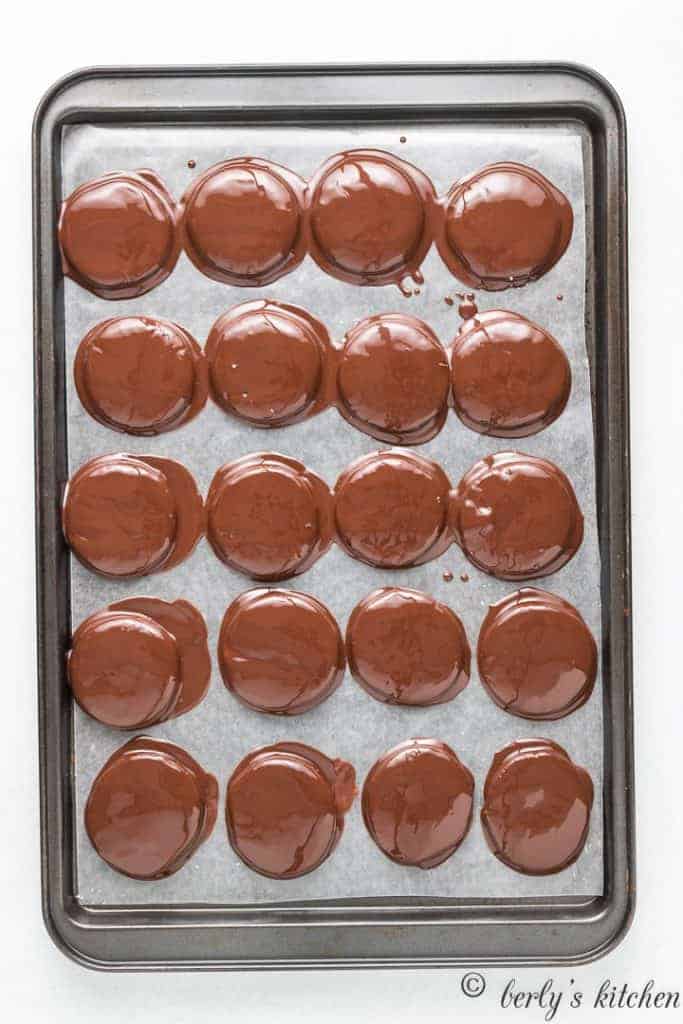 The peppermint patties topped with melted chocolate.