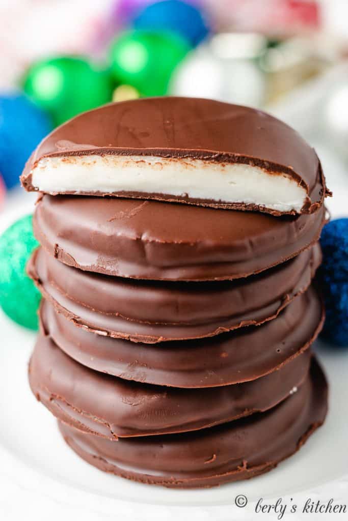 A peppermint patty cut in half to show the filling.