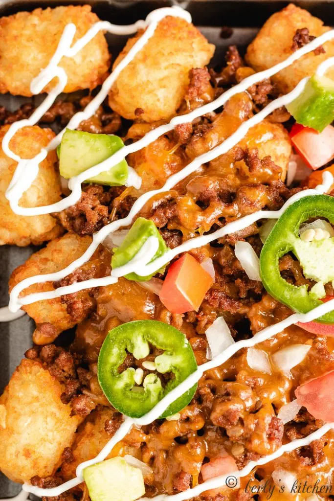 Close up photo of tater tot nachos with ground beef.