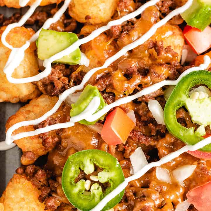 Close up photo of tater tot nachos with ground beef.