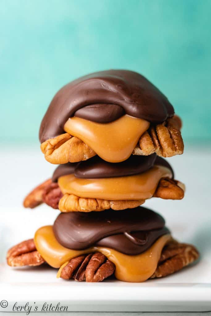 Three pieces of candy stacked on a plate.