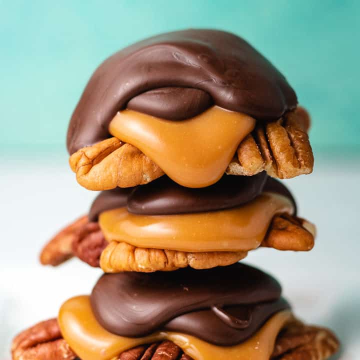 Three pieces of candy stacked on a plate.