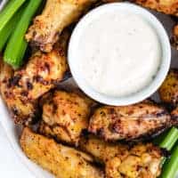 Top down view of chicken wings on a plate.