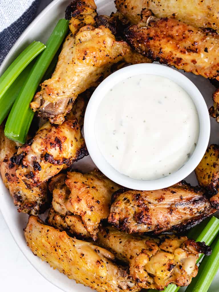 Top down photo of lemon pepper wings on a plate.