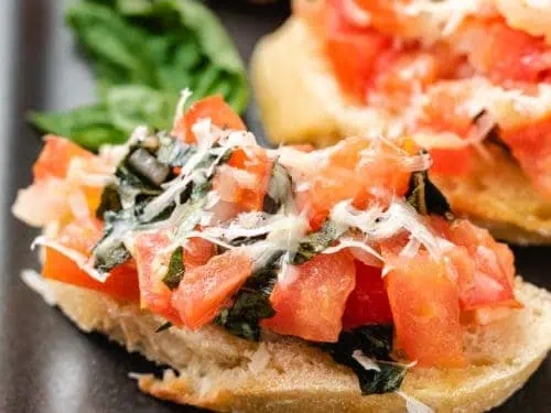 Easy tomato bruschetta with fresh basil.
