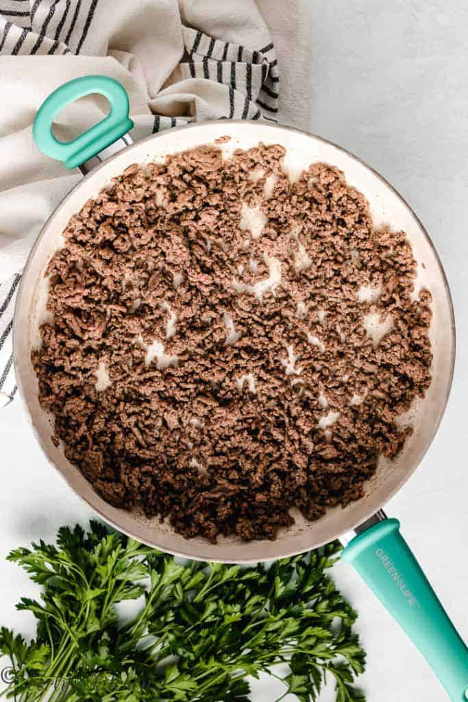 Cooked ground beef in a pan.