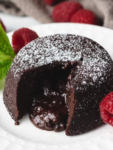 Molten lava cake with raspberries and mint.
