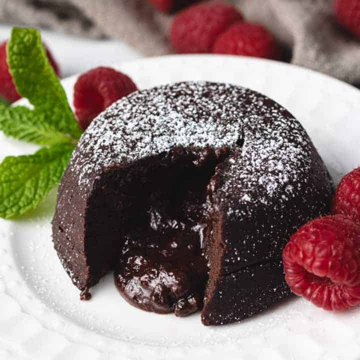 Molten lava cake with raspberries and mint.